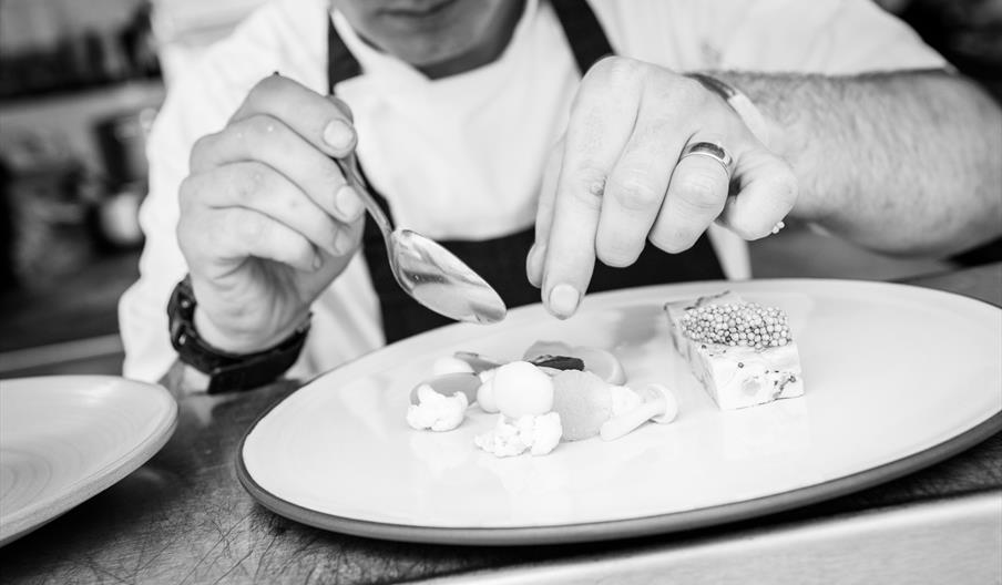 Chef plating up food