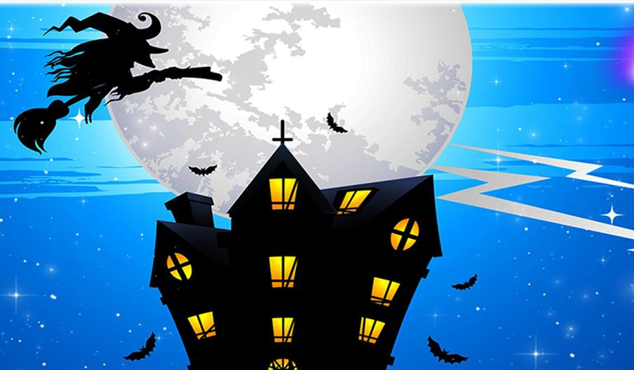 Witch flying over a darkened house with a large moon just above