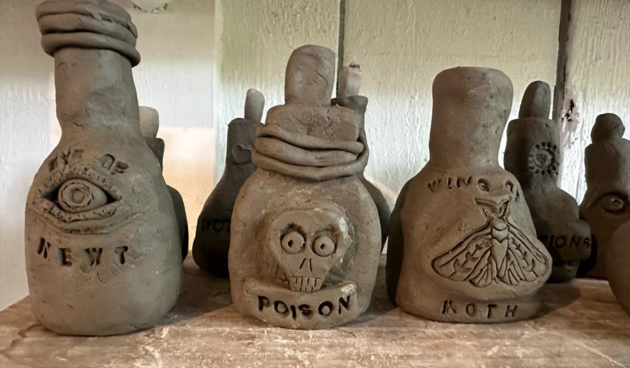 A photo of Clay pots made by children.