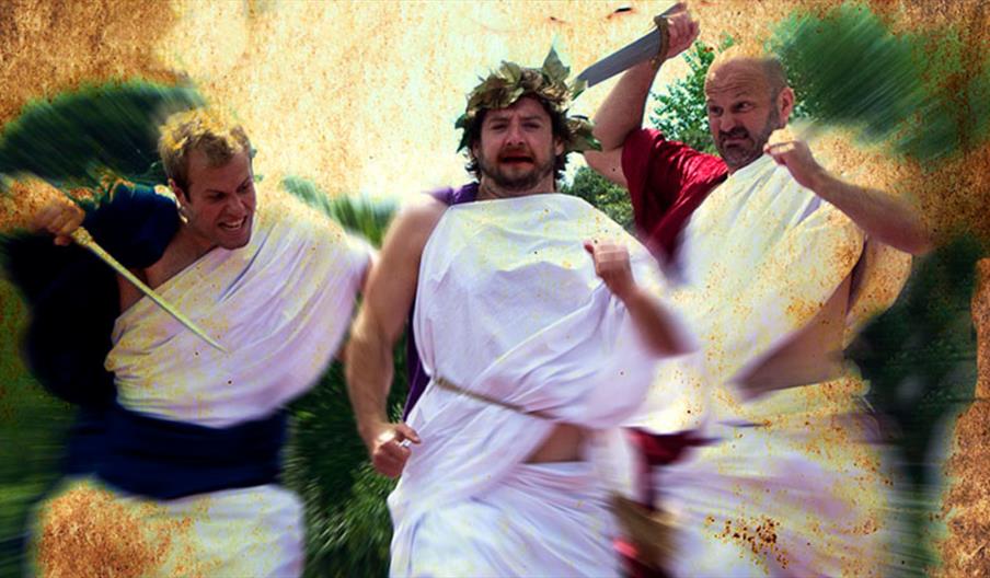 Three Oddsocks cast members dressed in togas