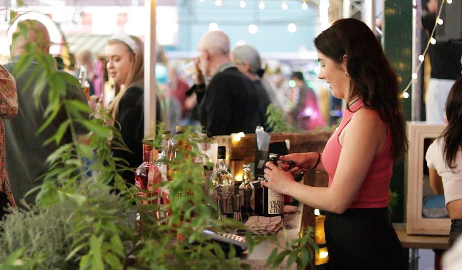 Bar staff serving drinks at Wellington Market