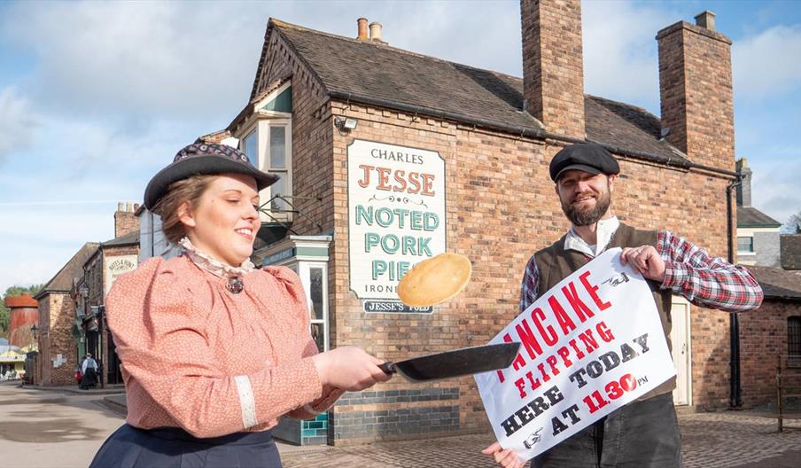 Blists Hill Victorian Town demonstrators flipping a pancake in a frying pan