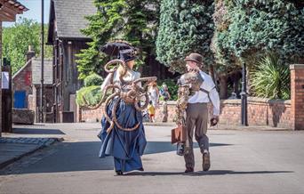 Steampunk festival attendees at Blists Hill Victorian Town wearing steampunk costumes