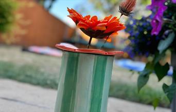 Hand-buillt and decorate a ceramic vase and flower frog