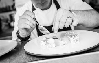 Chef plating up food