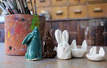 Ceramic bunny creations displayed on a table