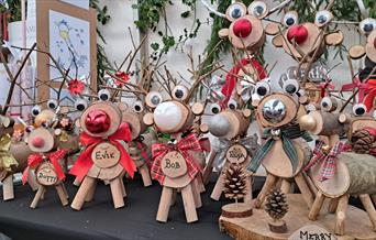 Christmas market stalls pictured with their wares.