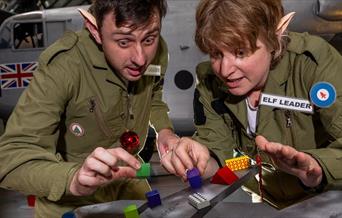 Two Elf Cadets doing the Load the Sleigh activity