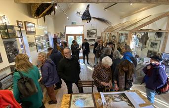 Visitor viewing the Coracle Stories exhibition