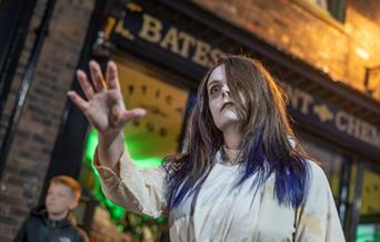 A photo of a demonstrator dressed as a ghost.