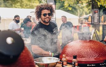 Adam Purnell pictured cooking over fire