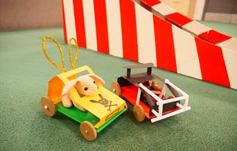 Two handmade vehicles containing bunnies