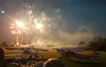 Ticket holders enjoying the display in the night sky