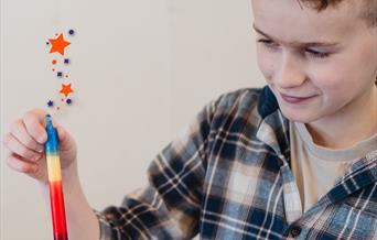 Boy holding a magic candle