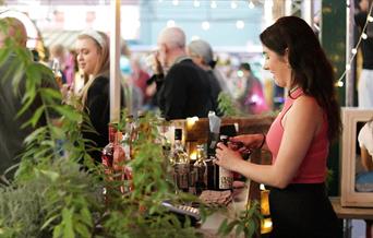 Bar staff serving drinks at Wellington Market