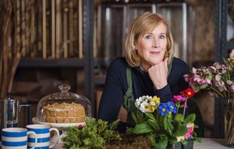 lady with flowers and cake