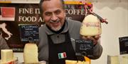 Cheese trader showcasing his products