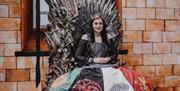 Female in Game of Thrones Costume on the Iron Throne