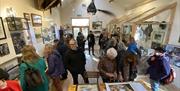 Visitor viewing the Coracle Stories exhibition