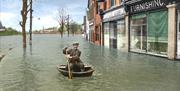 Harry Rogers in a coracle during floods in Ironbridge 1947