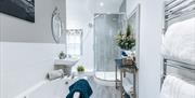Spacious bathroom - Large corner shower and a bath to relax in after a day exploring Ironbridge