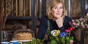 lady with flowers and cake