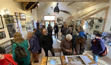 Visitor viewing the Coracle Stories exhibition