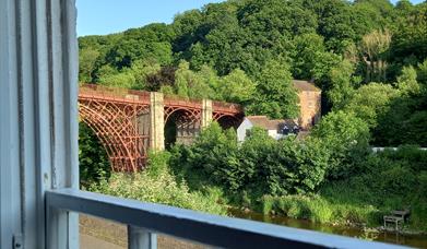 Stunning view of the first iron Bridge in the world, can be enjoyed from the comfy sofa at Ironbridge View Townhouse