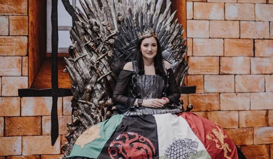 Female in Game of Thrones Costume on the Iron Throne