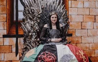 Female in Game of Thrones Costume on the Iron Throne