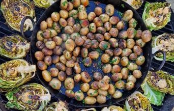 Vegetables cooking on an open grill