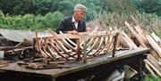 A picture of Eustace making a coracle