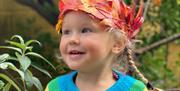Little girl wearing a leaf crown