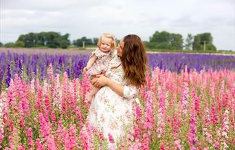 Mother and child stood in Shropshire Flower Field