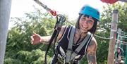 Happy lady on the high ropes
