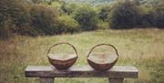 Two Rustic Frame Baskets on a bench