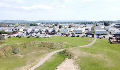 Aerial view of a holiday park and sand dunes