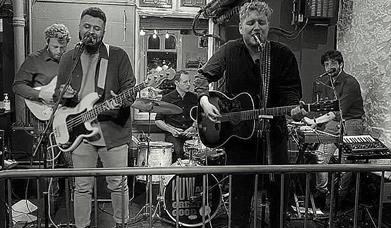 Black and white picture of the Greater Good band