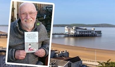 A man holding the book he has written is the inset image, over the main picture of a pier jutting out to sea from a sandy beach