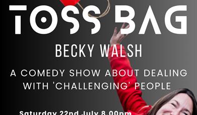 Tossbag - photograph of Becky in a red jacket, throwing a red paper bag into the air.