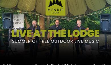 Three men playing guitar and singing into microphones under tented woodland canopy. Mendip Lodge logo. Text promotes Live at the Lodge: Summer of free