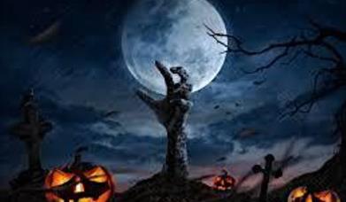 A hand coming through the ground with pumpkins on the floor and the full moon in the background.