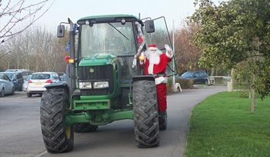 Santa Arrives by Tractor