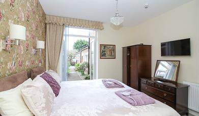 The Beach House bedroom in the ground floor apartment