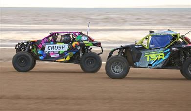 Two SXS Sand Buggies racing along Weston-super-Mare beach