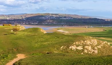 Scenic view from the top of Brean Down looking back over the summit of the Down and over the  estuary towards Bleadon