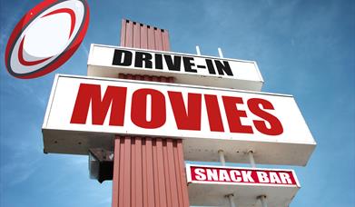 An American-style Drive-In movies sign with a rugby ball super-imposed on it