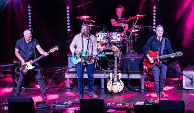 Members of the Eastertown band performing on stage at the Grand Pier, Weston-super-Mare