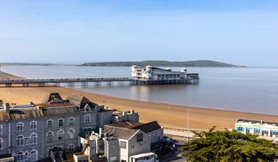 Aerial view over Weston-super-Mare beach and Grand Pier on a sunny day