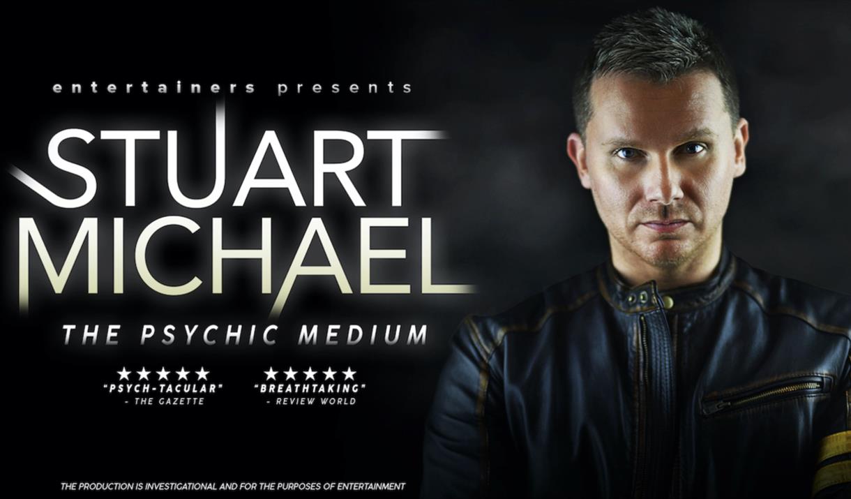 Stuart Michael on the right and the title in white glowing on the left.